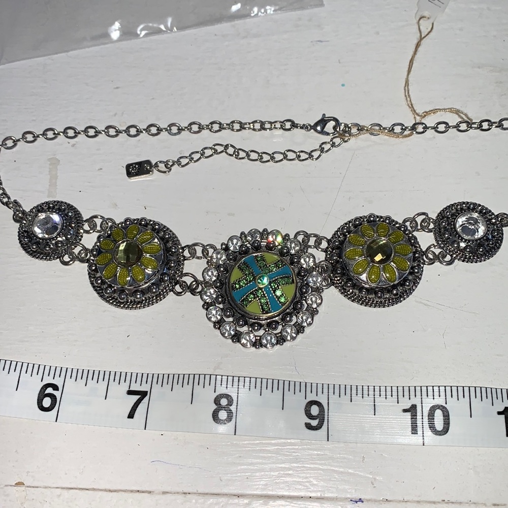One 16.5”+ 2.5” extender silvertone necklace with 5 stations and 3 snaps. NWT.